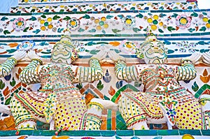 The sculptures of Yakshas - the spirit guardians, on the Prang of Wat Arun temple in Bangkok, Thailand