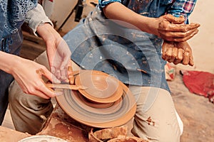 Sculpturing the clay pot