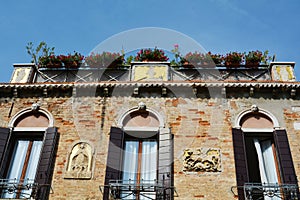 Sculpures and windows, Venice, Italy