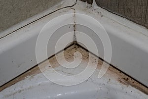 Scum build up around bath tub edge photo