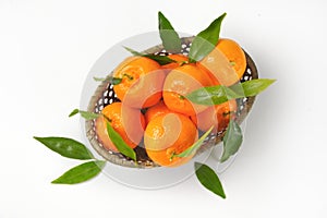 Scuttle of ripe tangerines