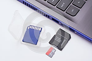 SD memory cards lays near computer