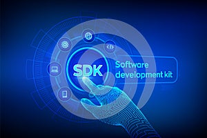 SDK. Software development kit programming language technology concept on virtual screen. Technology Concept. Robotic hand touching
