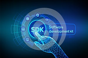 SDK. Software development kit programming language technology concept on virtual screen. Technology Concept. Robotic hand touching