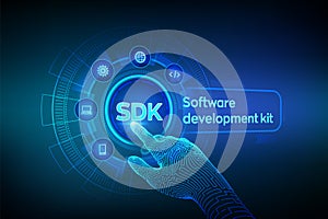 SDK. Software development kit programming language technology concept on virtual screen. Technology Concept. Robotic hand touching
