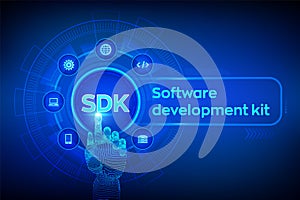 SDK. Software development kit programming language technology concept on virtual screen. Technology Concept. Robotic hand touching