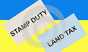 SDLT - Stamp duty for land tax is written on the card against a blue and yellow background