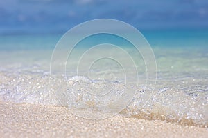 Sea aerial view, amazing tropical nature background. Beautiful bright sea with waves splashing and beach