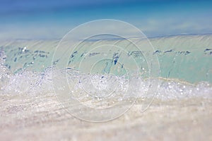 Sea aerial view, amazing tropical nature background. Beautiful bright sea with waves splashing and beach