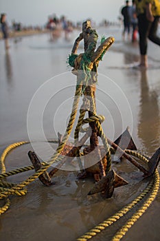 Sea anchor on the beach . Bright color. Yellow. Asia. India