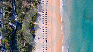 Sea background Aerial view Top down sea waves crashing on sandy beach beautiful sand sea surface in Phuket thailand