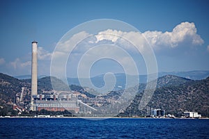 Sea on a background of mountains and blue sky