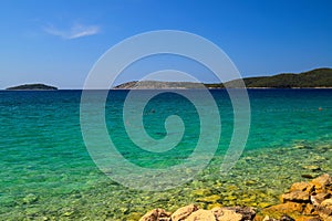 Sea background, Sibenik, Croatia. Transparent, clear water on an ecologically clean, picturesque summer beach. Croatian photo