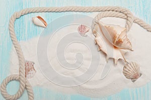 Sea background with white sand and blue painted wood, starfish, shells