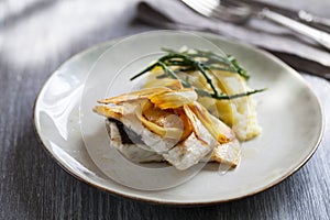 Sea bass fillet with parsnip crisps