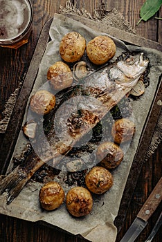 Sea Bass Stuffed with Sorrel and Baked with Potatoes