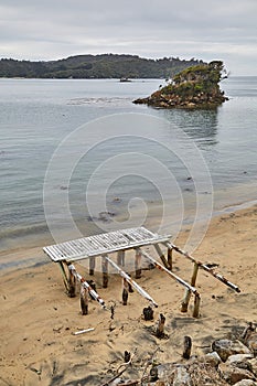 Sea bay harbor landscape, Oban, New Zealand, abandoned pier ruins