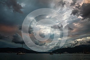 Sea bay with yachts on impressive dramatic sky background in Tivat, Montenegro