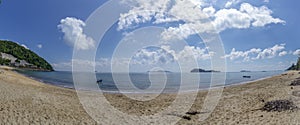 The sea and the beach at noon. The bright sky, the clouds are white.â€‹Sea atmosphere at Sairee Beach, Chumphon Province, March