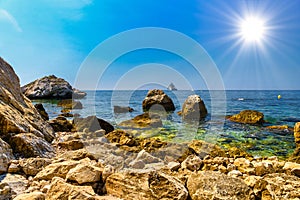 Sea beach with stones and rocks, Beausoleil, Nice, Nizza, Alpes-Maritimes, Provence-Alpes-Cote d\'Azur, Cote d\'Azur,