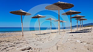 Sea beach umbrellas in preveza kanali greece