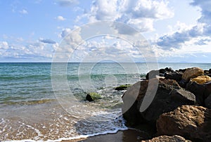 Sea beautiful waves blue clouds stones landscape skyline travel vacation background