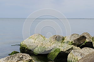 The sea with big rocks on the shore