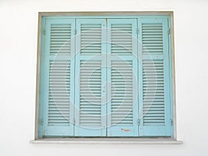 sea blue blinds on window with light skin tone walls