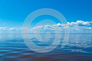 Sea and blue sky with clouds