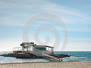 Sea bridge across Sea to bar in the Camp de Mar