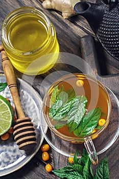 Sea buckthorn tea with honey and lime above