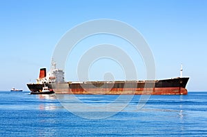 Sea bulk carrier with pilot boat