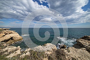 The sea in Calafat on the darted coast of Tarragona photo