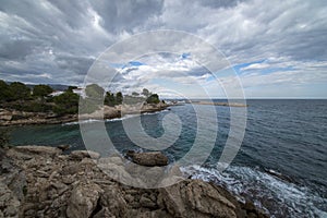 The sea in Calafat on the darted coast of Tarragona photo