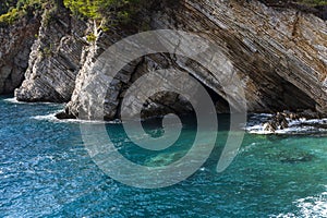 Sea and cave in rocky clifs in Petrovac, Montenegro