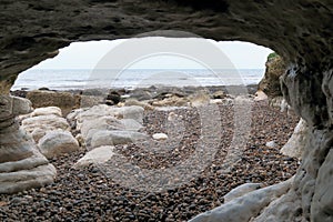 Sea cave under Beer Head in Devon photo