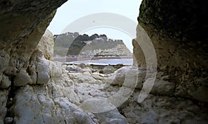 Sea cave under Beer Head in Devon photo