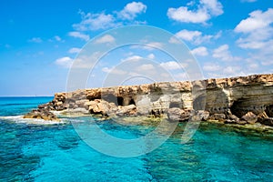 Sea caves near Ayia Napa in Cyprus. Natural rock formation famouse for cliff jumping into clear water. Dramatic