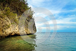 Sea cliff on Bolilanga Island. Togean Islands