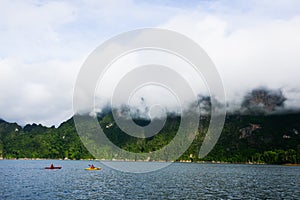 Sea cloud mountain view paddle boat explorer