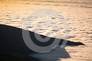 Sea of clouds below the summit of Teide volcano in Tenerife