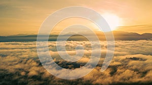 Sea clouds during golden sunrise above the Titiwangsa range mountains in Lenggong, Perak