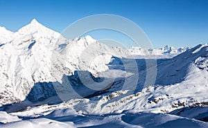 Sea of clouds Zermatt Matter valley and snowy mountains sunset view winter landscape Swiss Alps light