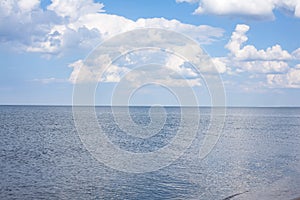 Sea and cloudy blue sky. Summer holidays landscape.