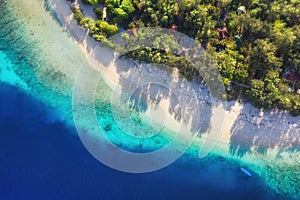 Sea coast as a background from top view. Turquoise water background from top view. Summer seascape from air. Bali island, Indonesi