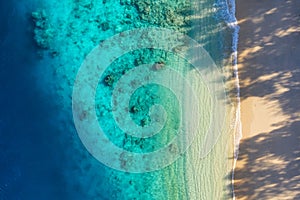 Sea coast as a background from top view. Turquoise water background from top view. Summer seascape from air. Bali island, Indonesi