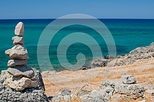 Sea coast and beach with rocks, rocky coastline, blue sea, good sunny day. Summer trip. Beautiful Greece