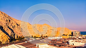 Sea coast of the Gulf of Oman, a small settlement or town on the shore