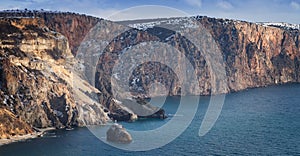 Sea coast with high cliffs over the sea