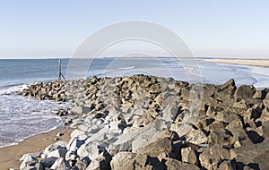Sea coast with rock breakwater at Dinas Dinlle